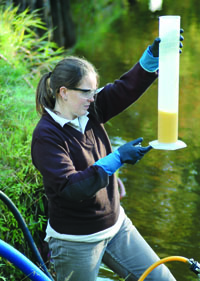 U.S. Fish and Wildlife Service control agent measing lampricide for application in a great lakes tributary.