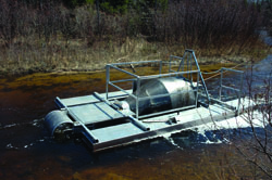 Experimental fishwheel trap operating mid stream